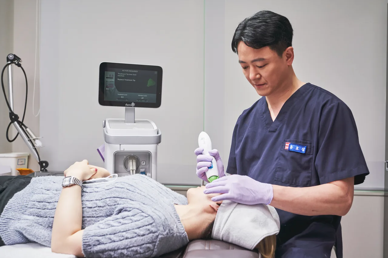 Dermatologist performing a non-surgical skin treatment at Wells Clinic